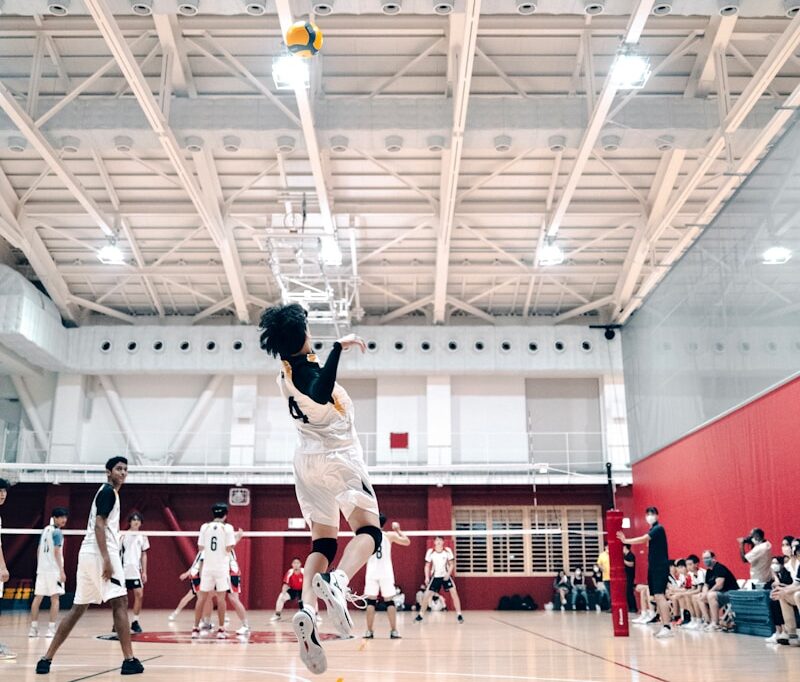 a group of people playing basketball
